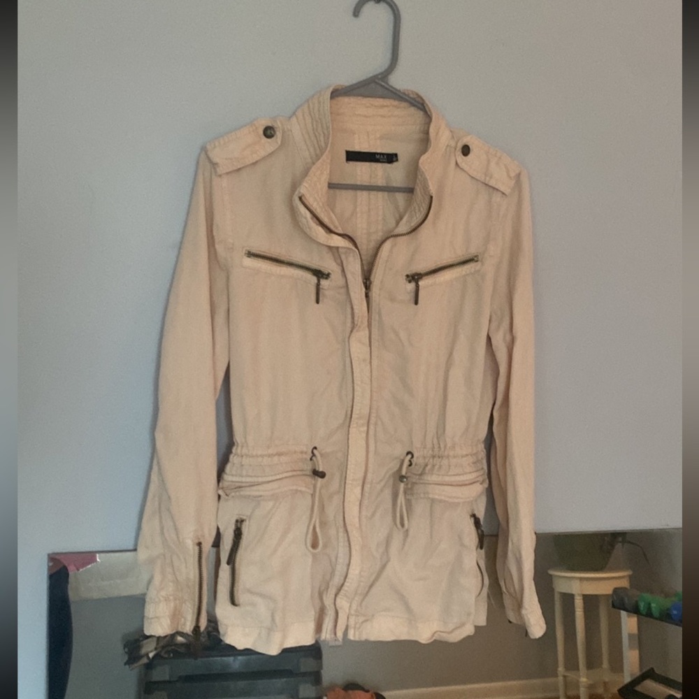 Cream colored lightweight jacket.